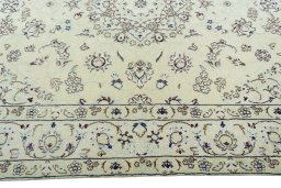 Corner detail of 2000s Nain rug showing border pattern and Wool pile