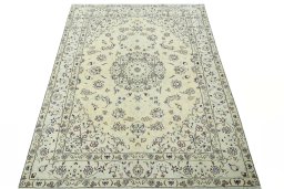 Surface texture of 2000s Nain rug with natural Wool and intricate pattern