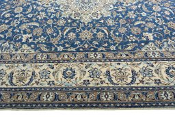 Corner detail of 2000s Nain rug showing border pattern and Wool pile