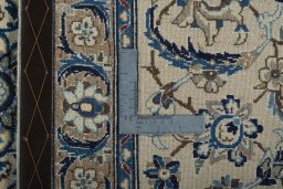 Backside of handmade 2000s Nain rug showing knot structure and weave density