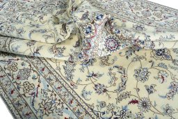 Surface texture of 2000s Nain rug with natural Wool and intricate pattern