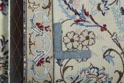Backside of handmade 2000s Nain rug showing knot structure and weave density