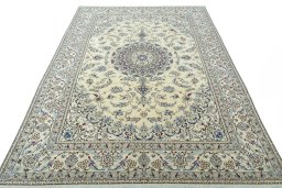 Surface texture of 2000s Nain rug with natural Wool and intricate pattern