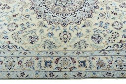 Corner detail of 2000s Nain rug showing border pattern and Wool pile