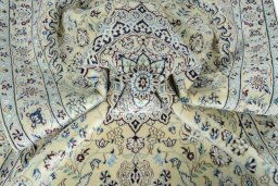 Surface texture of 2000s Nain rug with natural Wool and intricate pattern