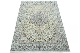 Surface texture of 2000s Nain rug with natural Wool and intricate pattern