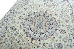 Backside of handmade 2000s Nain rug showing knot structure and weave density