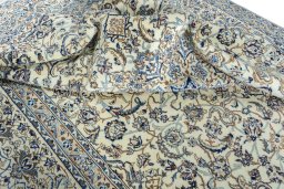 Surface texture of 2000s Nain rug with natural Wool and intricate pattern