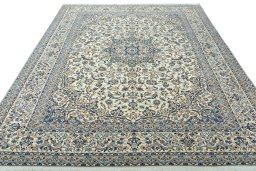 Surface texture of 2000s Nain rug with natural Wool and intricate pattern