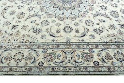 Corner detail of 2000s Nain rug showing border pattern and Wool pile