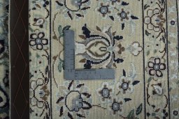 Backside of handmade 2000s Nain rug showing knot structure and weave density