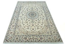 Surface texture of 2000s Nain rug with natural Wool and intricate pattern