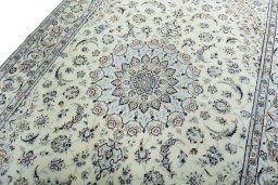 Backside of handmade 2000s Nain rug showing knot structure and weave density
