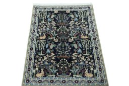 Surface texture of 2000s Nain rug with natural Wool and intricate pattern