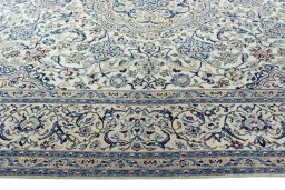 Corner detail of 2000s Nain rug showing border pattern and Wool pile