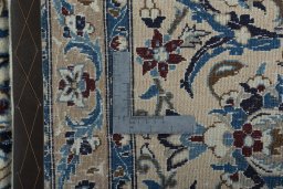 Backside of handmade 2000s Nain rug showing knot structure and weave density