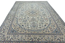 Surface texture of 2000s Nain rug with natural Wool and intricate pattern