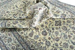 Surface texture of 2000s Nain rug with natural Cork and intricate pattern