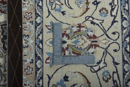 Backside of handmade 2000s Nain rug showing knot structure and weave density