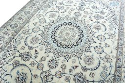 Backside of handmade New Nain rug showing knot structure and weave density