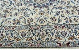 Corner detail of 2000s Nain rug showing border pattern and Wool pile