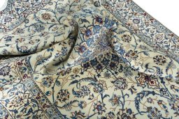 Surface texture of 2000s Nain rug with natural Wool and intricate pattern