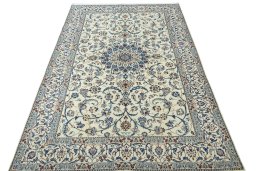 Surface texture of 2000s Nain rug with natural Wool and intricate pattern