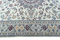 Corner detail of 2000s Nain rug showing border pattern and Wool pile
