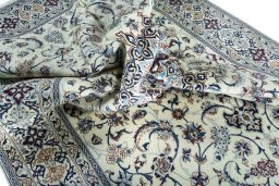 Surface texture of 2000s Nain rug with natural Wool and intricate pattern