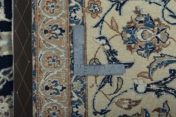 Backside of handmade 2000s Nain rug showing knot structure and weave density