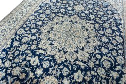 Backside of handmade 2000s Nain rug showing knot structure and weave density