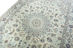 Backside of handmade New Nain rug showing knot structure and weave density