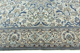 Corner detail of 2000s Nain rug showing border pattern and Wool pile