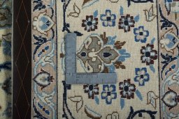 Backside of handmade 2000s Nain rug showing knot structure and weave density