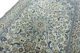 Backside of handmade 2000s Nain rug showing knot structure and weave density