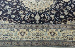 Corner detail of 2000s Nain rug showing border pattern and Cork pile