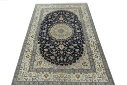 Surface texture of 2000s Nain rug with natural Cork and intricate pattern