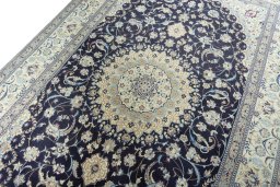 Backside of handmade 2000s Nain rug showing knot structure and weave density