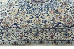 Corner detail of 2000s Nain rug showing border pattern and Wool pile