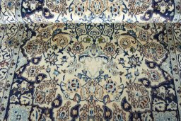 Close-up detail of 2000s Nain rug from Iran / Persia showing Wool weave