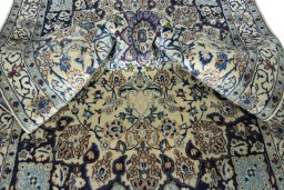 Surface texture of 2000s Nain rug with natural Wool and intricate pattern