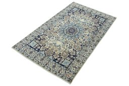 Corner detail of 2000s Nain rug showing border pattern and Wool pile