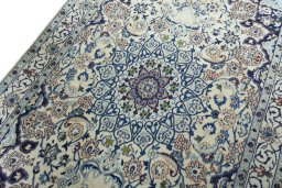 Backside of handmade 2000s Nain rug showing knot structure and weave density