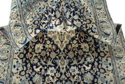 Surface texture of 2000s Nain rug with natural Wool and intricate pattern