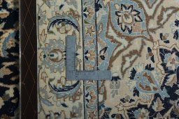 Backside of handmade 2000s Nain rug showing knot structure and weave density