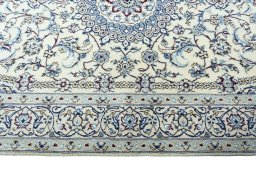 Corner detail of 2000s Nain rug showing border pattern and Wool pile