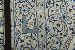 Backside of handmade 2000s Nain rug showing knot structure and weave density