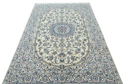 Surface texture of 2000s Nain rug with natural Wool and intricate pattern