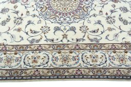 Corner detail of 2000s Nain rug showing border pattern and Wool pile