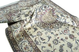 Surface texture of 2000s Nain rug with natural Wool and intricate pattern